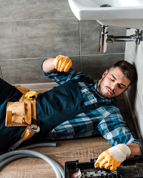 bearded-handyman-lying-on-floor-near-toolbox-in-ba-resize