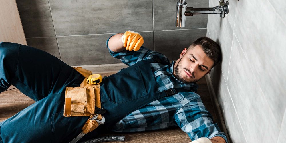 bearded-handyman-lying-on-floor-near-toolbox-in-ba-resize