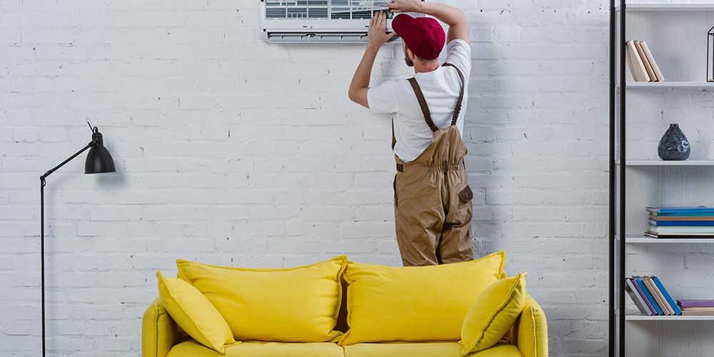professional-repairman-fixing-air-conditioner-hang-resize