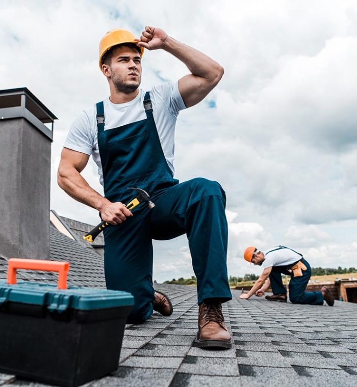 selective-focus-of-handsome-handyman-touching-helm-resize