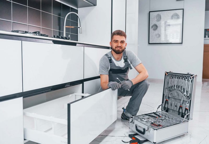 young-professional-plumber-in-grey-uniform-using-e-resize