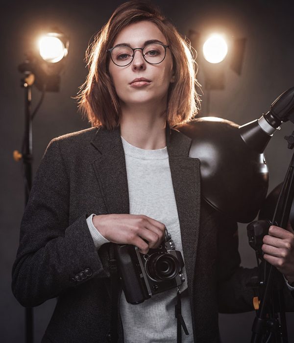 beautiful-redhead-female-photographer-holds-a-digi-resize