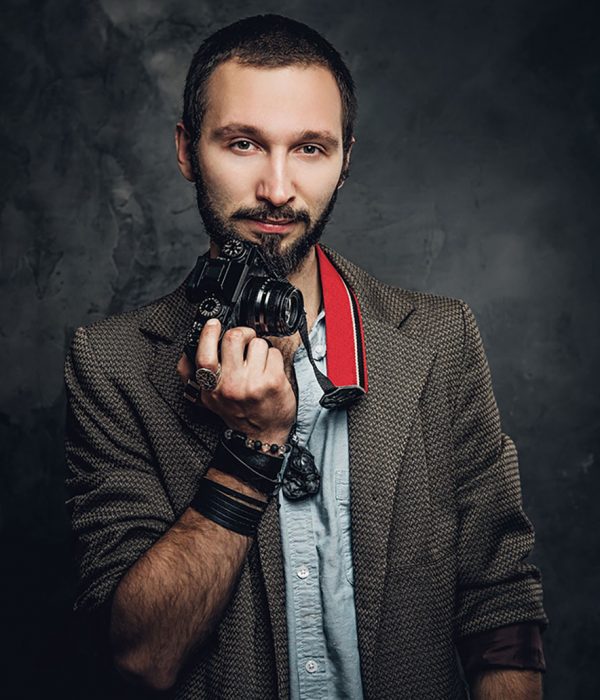 man-is-posing-for-photographer-with-photo-camera-resize