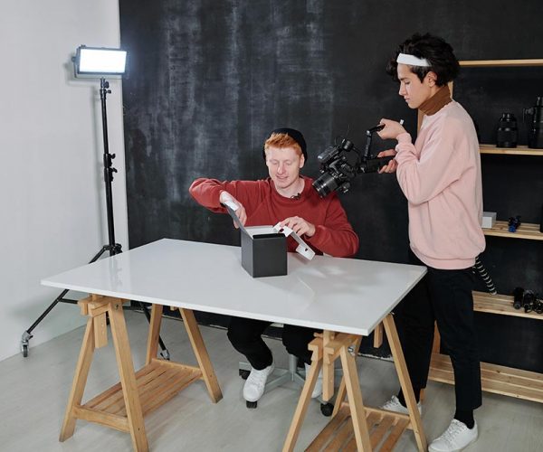 young-cameraman-with-video-equipment-shooting-male-resize